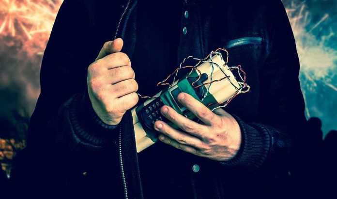 Person holding a homemade explosive device