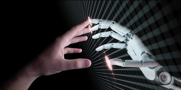 650850907 Human and robotic hand reaching out to touch.