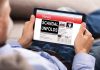 Person reading tablet with headline Scandal Unfolds