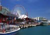 Navy Pier in Chicago with a ferris wheel and boats along the waterfront