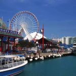 Navy Pier in Chicago with a ferris wheel and boats along the waterfront