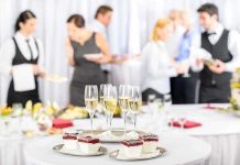 A table set with champagne glasses and desserts at a social event