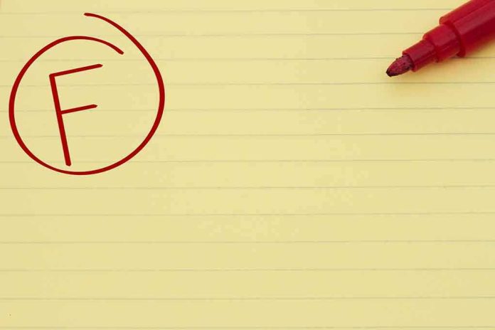 shutterstock_141798160.jpg Yellow notepad with a red marker and a circled grade F