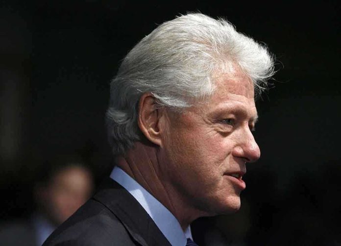 Profile portrait of a man with gray hair in formal attire