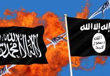 Two black flags with Arabic writing, flames background.
