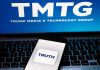 TMTG and Truth Social logos on screen and phone.