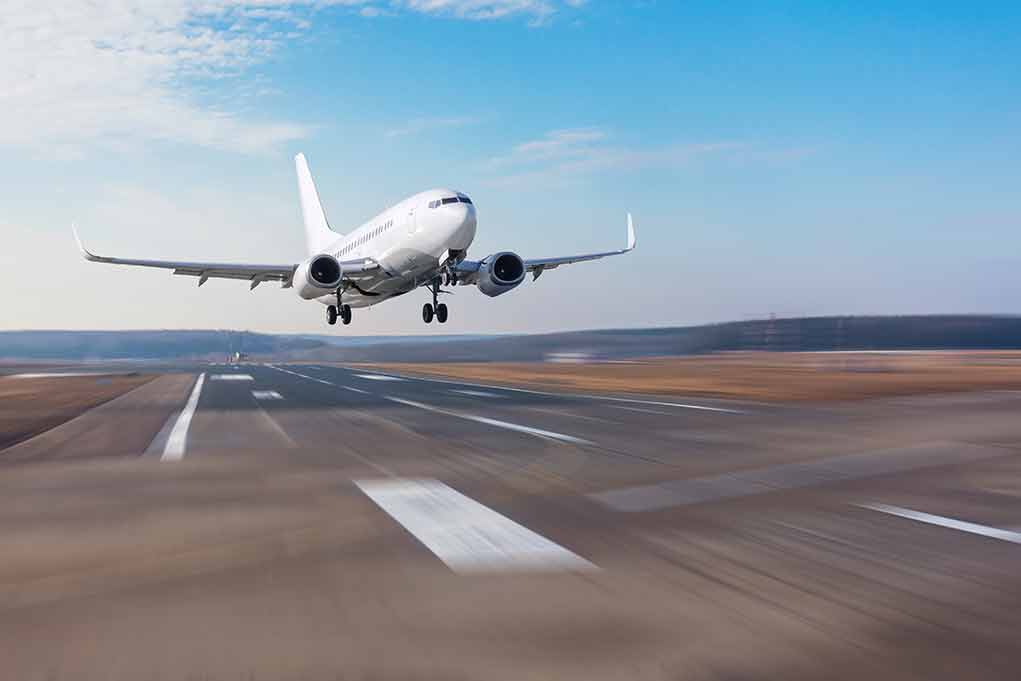 1686173956 featured image Airplane landing on runway under clear blue sky