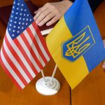American and Ukrainian flags on meeting table
