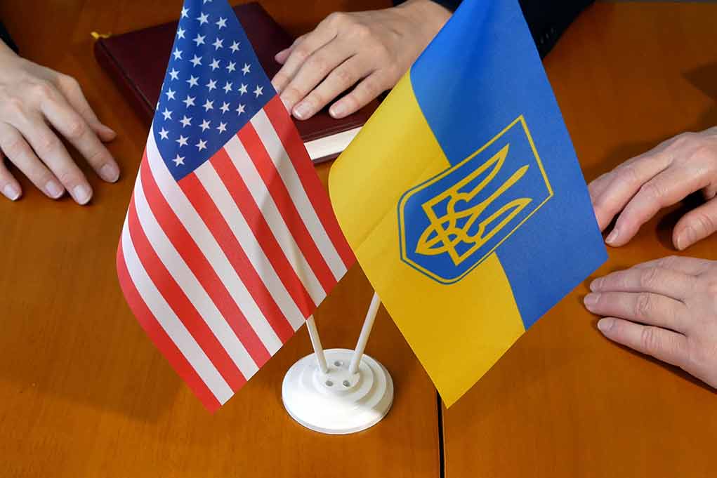 American and Ukrainian flags on meeting table