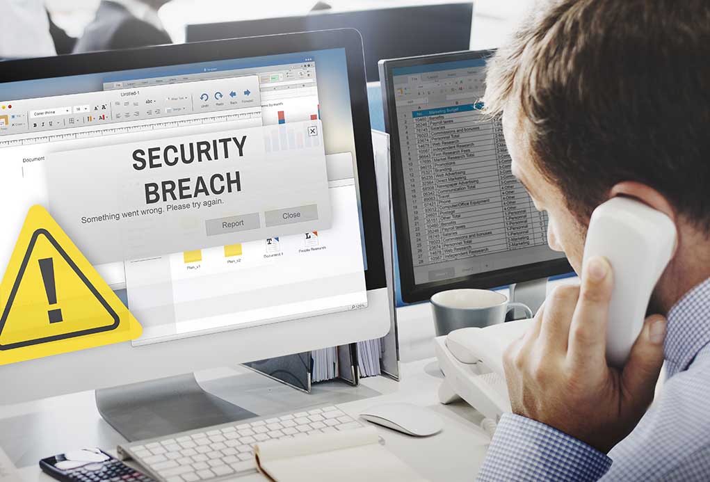 Security breach alert displayed on computer monitor.