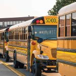 Texas Schools Warn Parents Of Border Patrol Checks On Student Buses School buses lined up in front of building.