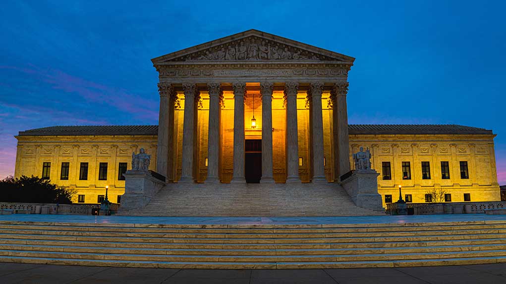 1667066965 featured image Illuminated courthouse building at dusk with columns