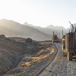 State Department Alters Armored Vehicle Strategy Amidst Musk Influence Concerns Military vehicles on a mountainous dirt road