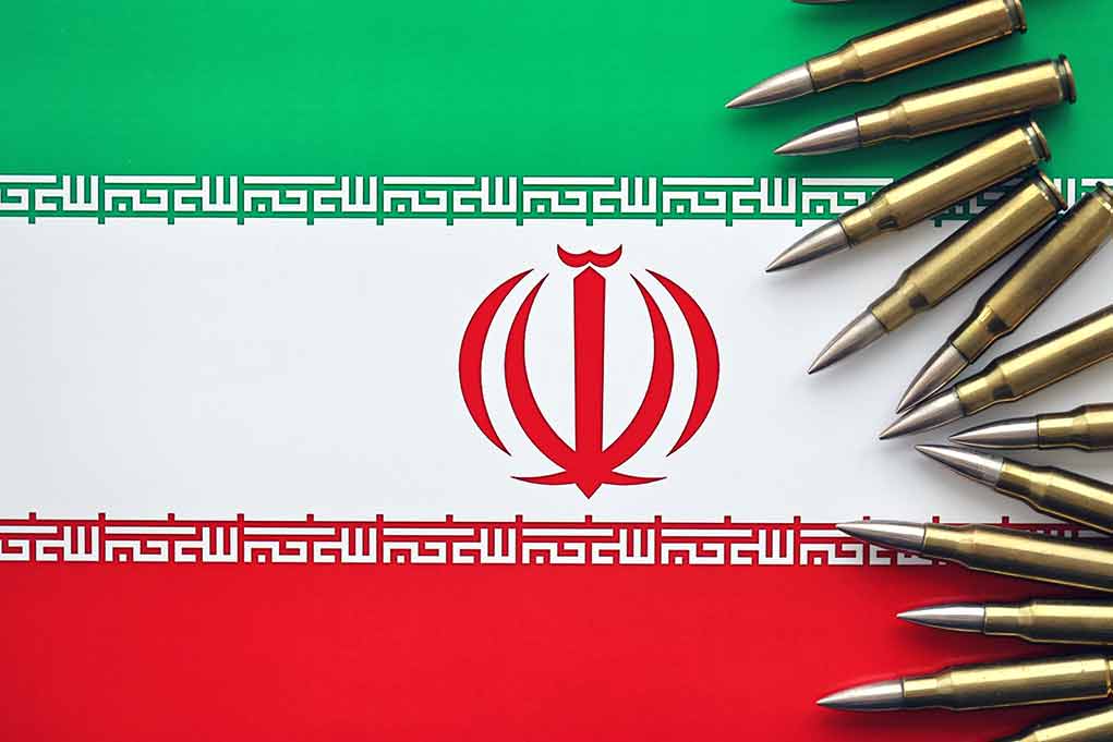 2394440491 featured image Iranian flag with bullets on top corner