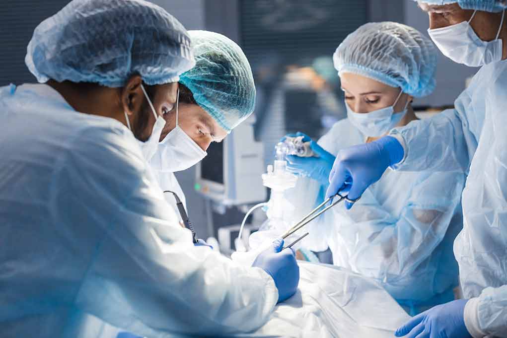 1265400856 featured image Medical team performing surgery in operating room