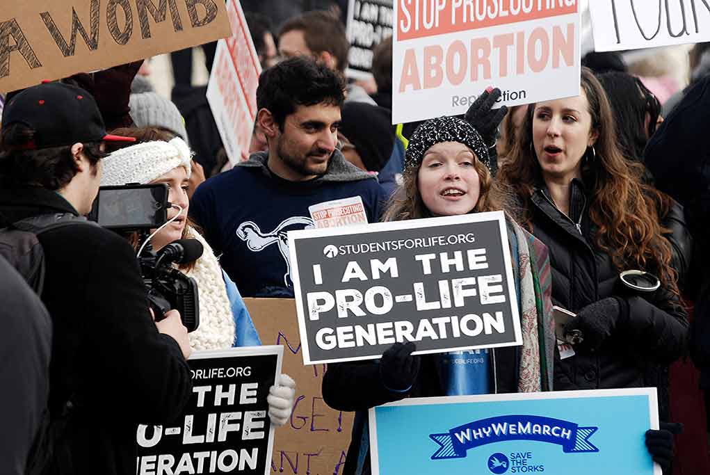 1291055839 featured image Prolife rally with people holding signs and banners