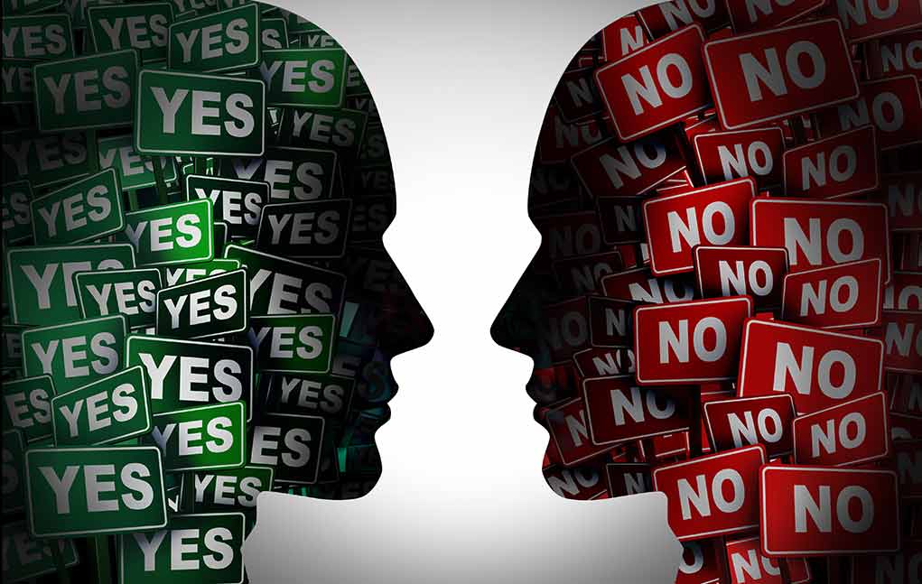 1994812379 featured image Silhouettes filled with YES and NO signs facing each other.
