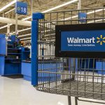 Walmart Faces Backlash From China Over Tariff Cost Negotiations Walmart shopping cart inside store near checkout aisle