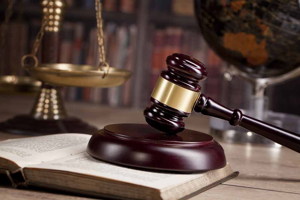 782972068 featured image Gavel on book beside scales of justice