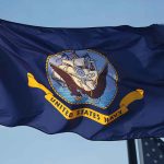 What Prompted The Unexpected Book Culling At The Naval Academy United States Navy flag waving in the wind.