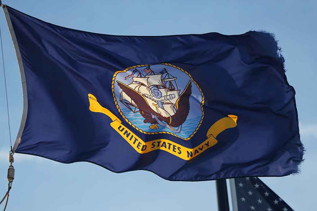 1409179982 featured image United States Navy flag waving in the wind.