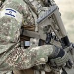 Israeli Air Force Reservists Urge Hamas Dialogue IDF soldier holding rifle