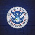 DHS Hopes To Catch Illegal Immigrants Using IRS Data US Department of Homeland Security emblem on wall