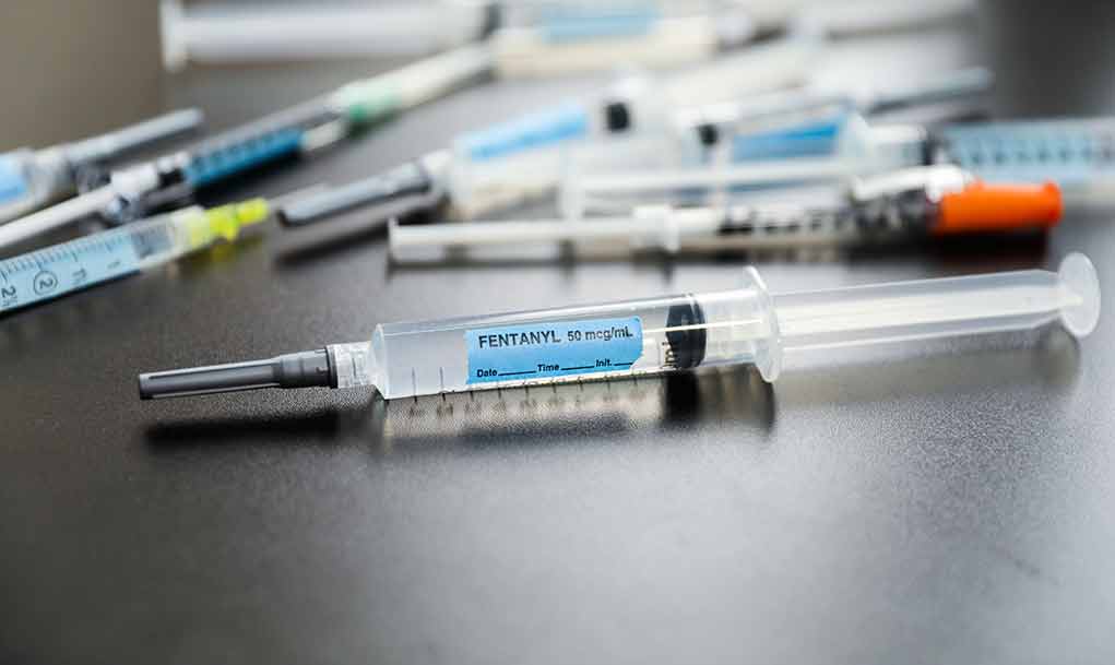 2312398829 featured image Syringes on table one labeled Fentanyl 50 mcg/ml