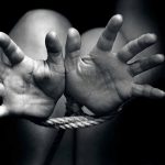 Open hands tied with rope in black and white