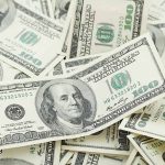 Pile of one hundred dollar bills