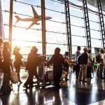 People in line at busy airport terminal
