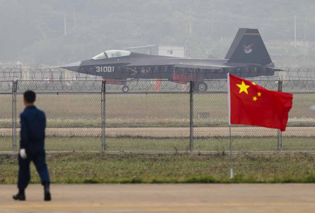 231381238 featured image Jet with marking behind barbed wire fence