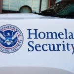 Homeland Security logo and text on vehicle door