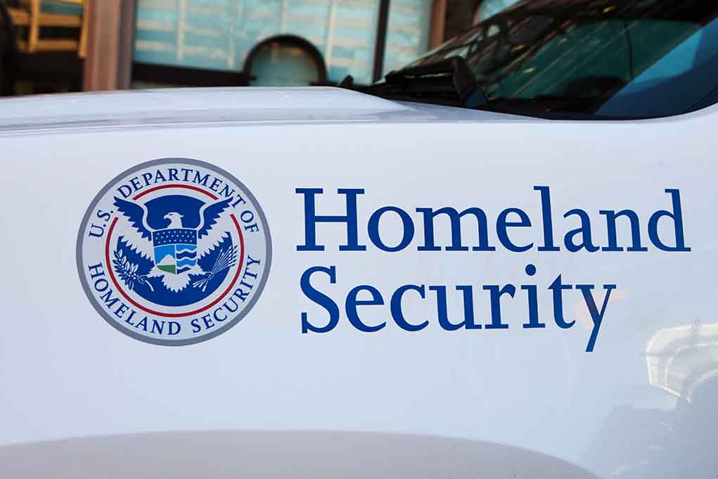Homeland Security logo and text on vehicle door