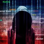 Hooded figure with cybersecurity related words and binary code
