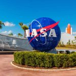 Space Mission SHOCK – Team Includes Three Firsts NASA logo sculpture with spaceship and palm trees
