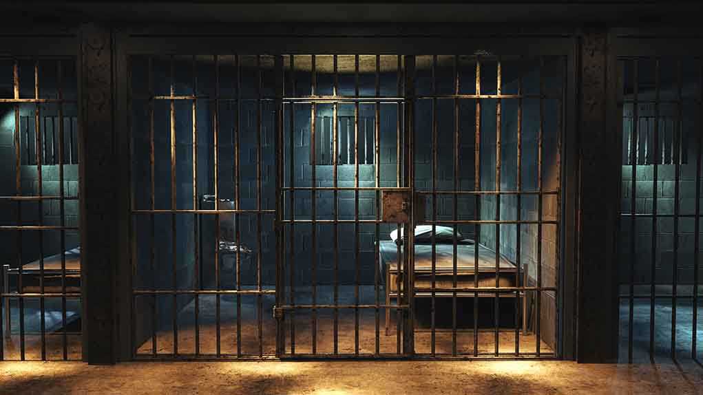 1427252378 featured image Empty prison cell with metal bars and bed