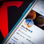 Musk DROPS Dragon — NASA Reeling From Fallout Phone screen showing Twitter profile with spacescapes