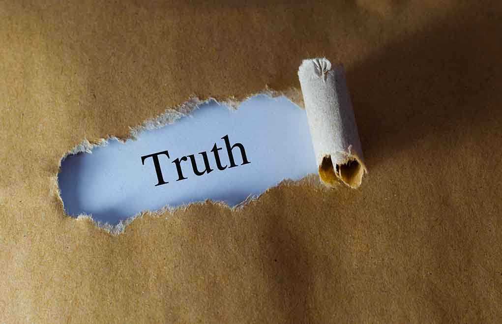384729706 featured image Ripped paper reveals word truth underneath brown surface