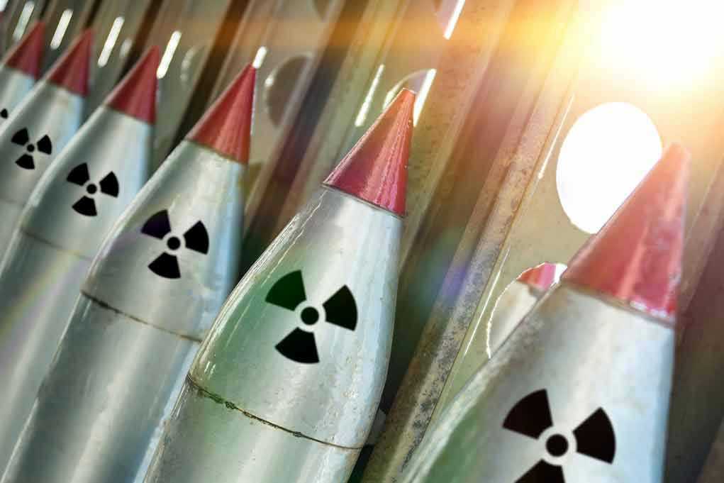 1090003628 Line of nuclear missiles with radiation hazard signs