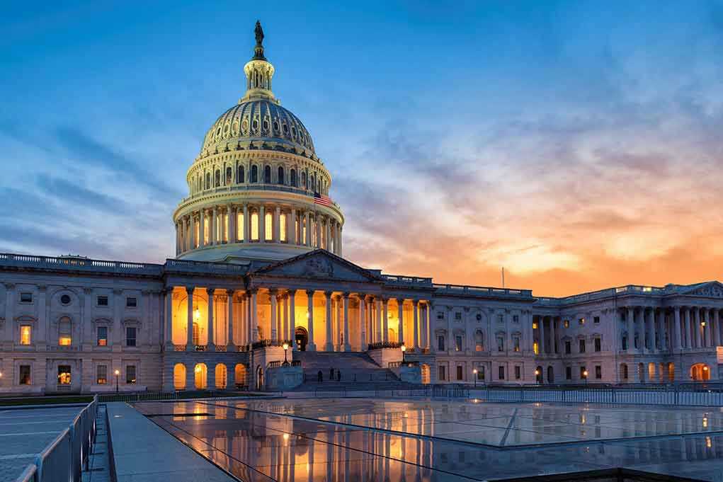 U.S. Capitol building illuminated at sunset