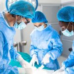 Living Patients at Risk: Organ Procurement Protocols IGNORED Surgeons performing an operation in a sterile environment.