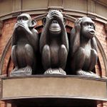 Macaque Monkeys’ Crime Ring Shocks Bali Three wise monkeys statue on a brick building