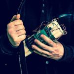 Tech-Driven Terror: AI Enables Bombing Attempt Person holding a homemade explosive device