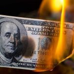 Tariff Tsunami Hits GM — $1.1 Billion Blow Burning hundred-dollar bill with visible flames
