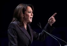 Kamala HINTS at Next Move – Dems Say NO! Person speaking at podium with raised finger.