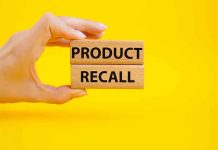 NATIONWIDE Recall Announcement—Millions Impacted Instantly Hand holding Product Recall blocks on yellow background.