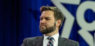 Man in a suit with a thoughtful expression.