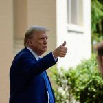 Trump Axes Billions—Dem Project VANISHES Overnight! Man in suit giving thumbs up.