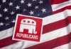 Tragedy Slams GOP Candidate – HEARTRBREAK! Republican symbol on American flag background.